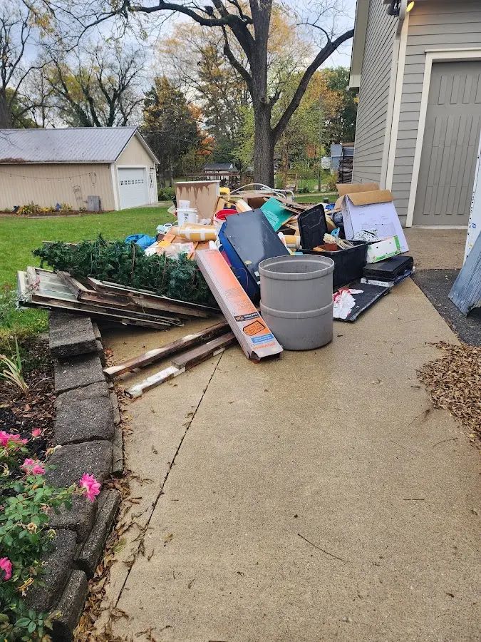 Dumpster being loaded with debris for Roofing Dumpster Rental in Buena Vista